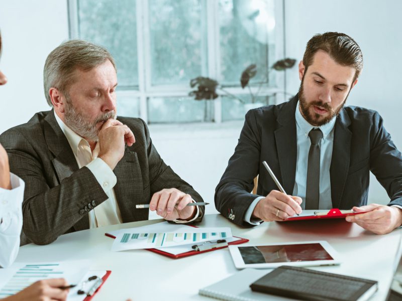 The business people working together at table. The meeting or summit concept